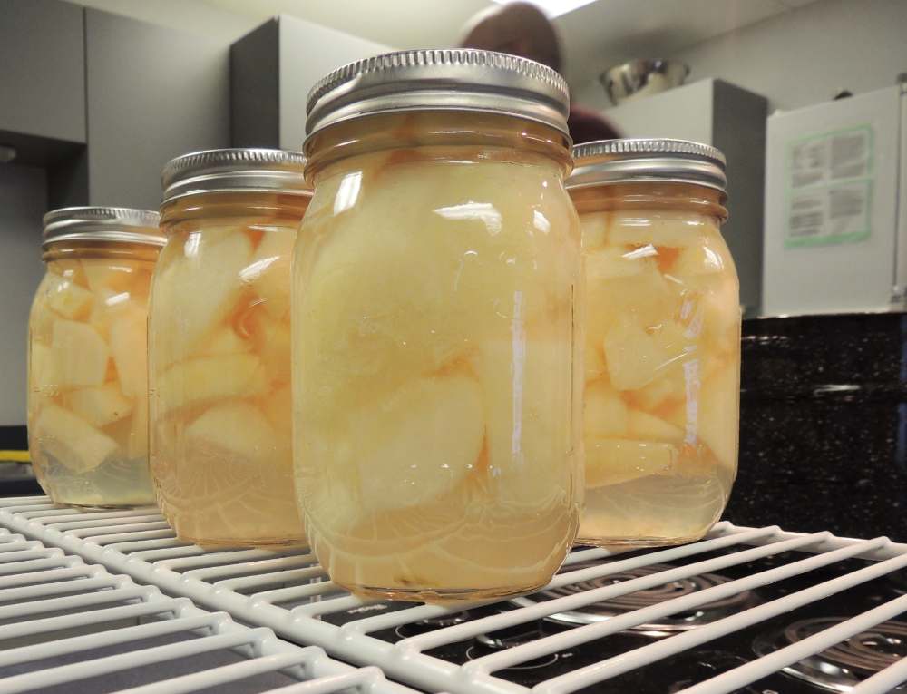 Canned pears preserved in glass mason jars